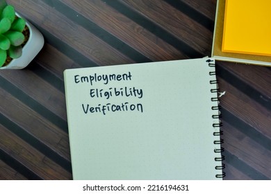 Concept Of Employment Eligibility Verification Write On A Book Isolated On Wooden Table. Selective Focus On Employment Eligibility Verification Text