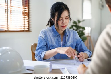 Concept Of Engineering Consulting, Two Female Engineers Brainstorming Sketches Blueprint Together.