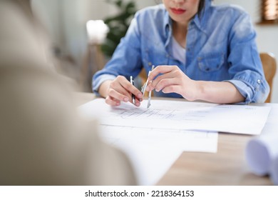 Concept Of Engineering Consulting, Two Female Engineers Brainstorming Sketches Blueprint Together.