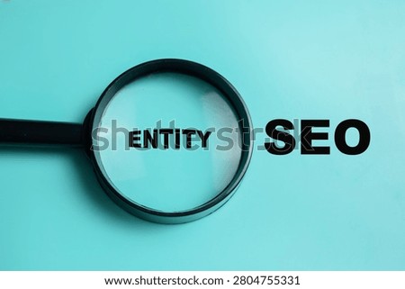 Concept of entity SEO write on book isolated on Wooden Table. For semantic search and search engine understanding