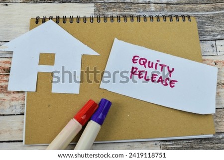 Concept of Equity Release write on sticky notes isolated on Wooden Table.