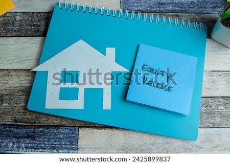 Concept of Equity Release write on sticky notes isolated on Wooden Table.