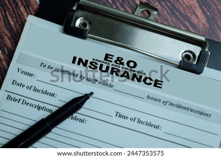 Concept of Errors and Omissions Insurance write on paperwork isolated on wooden background.