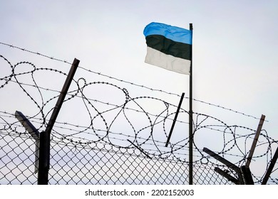 Concept of estonia closed borders with flag and wire fence. Ukraine immigration and homeland security. estonian Russian border - Shutterstock ID 2202152003