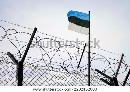 Concept of estonia closed borders with flag and wire fence. Ukraine immigration and homeland security. estonian Russian border