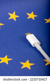 Concept For EU Law To Force USB-C Chargers For All Phones. EUROPEAN UNION Flag And USBC Universal Charging Cable As A Standard For Small Electronic Devices