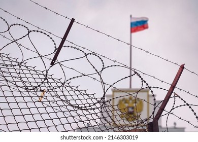 The concept of European and US sanctions pressure on the Russian Federation government. flag of the Russian Federation in barbed wire, sanctions and aggression of Russia. Russian prison - Shutterstock ID 2146303019