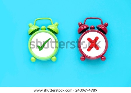 Concept of evaluation. True or false symbol. Accepted or rejected. Yes or no icon over a an alarm clock.	