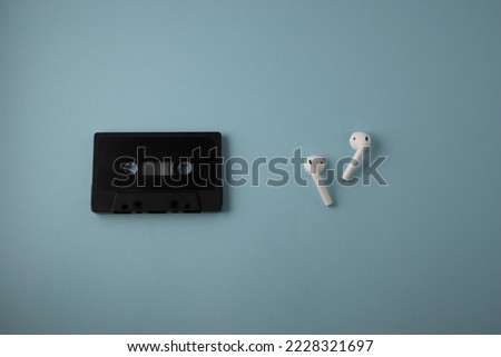 concept of evolution of musical devices in comparison, old cassette tape and wirless headphones