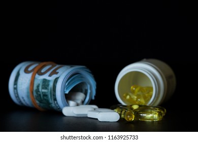 The concept of fake medicine. Tablets can illustrate investigation in the field of counterfeit drugs. The other meaning of photography is that money is the best medicine. - Shutterstock ID 1163925733