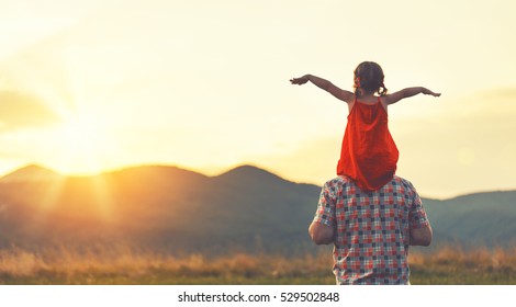 Concept Of Family. Father And Child Daughter Outdoors In Summer