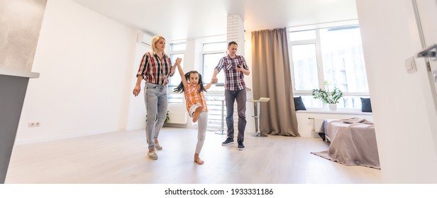 Concept family: Happy young family in the new apartment dream and plan interior