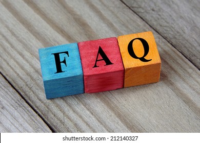 concept of FAQ word on wooden colorful cubes 
