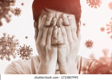 Concept Of Fear Of Coronavirus. Woman Covers Her Face Her Hands On Background With Coronavirus.