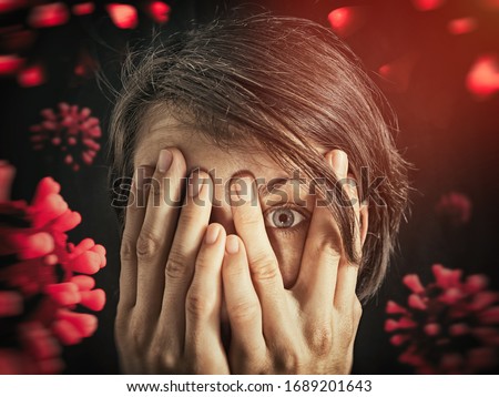 Concept of fear of coronavirus. Woman covers her face her hands on background with coronavirus. Stock photo © 