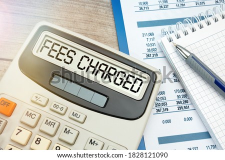 Concept Fees: FEES CHARGED words on calculator.