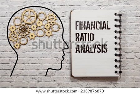 Concept of Financial Ratio Analysis write on sticky notes isolated on Wooden Table.