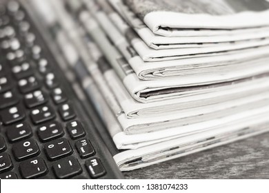 Concept Fo Journalism - Lots Of Newspapers And Magazines Stacked In Pile And Computer Keyboard. News And Business Data In Tabloid Journals                  