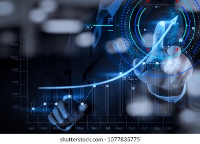 Concept of focus on target with digital diagram.Double exposure of businessman hand working with new modern computer and business strategy as concept