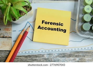 Concept of forensic accounting write on sticky notes isolated on Wooden Table.