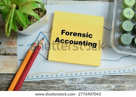 Concept of forensic accounting write on sticky notes isolated on Wooden Table.
