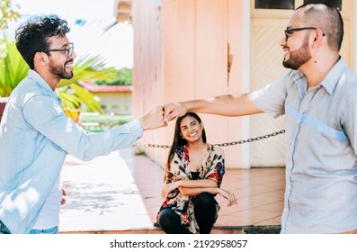 Concept of friends bumping fists amicably, Two overjoyed male friends bumping fists amicably on the street, Two teenage friends bumping their fists outdoors. - Shutterstock ID 2192958057