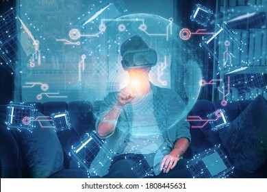 Concept future innovation,technology invention,young man use VR HeadSet open up modern experience,have fun,with virtual world full floating cube,learning artificial intelligence or AI with smart home - Shutterstock ID 1808445631