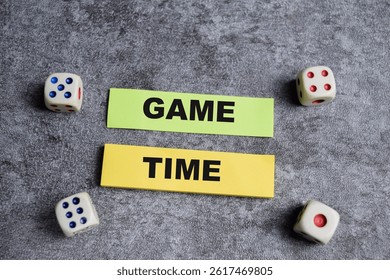Concept of Game time write on sticky notes isolated on Wooden Table.