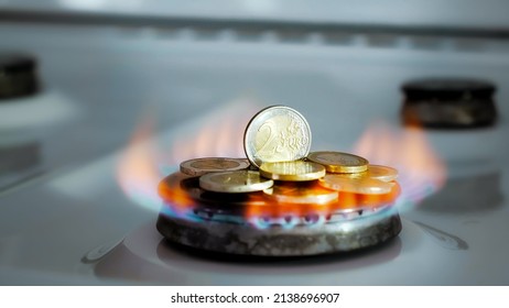 Concept Of Gas Crisis. 2 Euro Coins Is Burning On A Kitchen Stove Burner And Fall When The Gas End. High Prices Of Natural Resources. Fire Flame. Utility Debt. Energy War. Saving Home Budget. Finance.