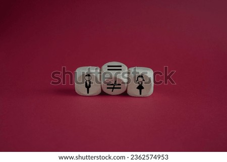 Concept of gender equality. Turned a cube and changed a unequal sign to a equal sign between symbols of men and women. Beautiful red background, copy space.