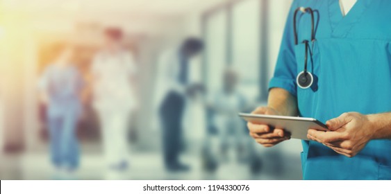 Concept of global medicine and healthcare. Doctor holds digital tablet. Diagnostics and modern technology in hospital