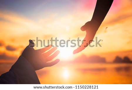 The concept of God's salvation:silhouette of helping hand concept and international day of peace
