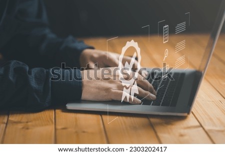 Concept of guarantee standards iso certification and standardization service quality and assurance : Businessman Is using a laptop to verify or certify something after he has verified it.	