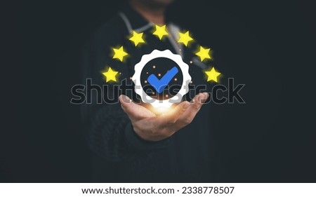 Concept of guarantee standards iso certification and standardization service quality and assurance : Businessman Is using finger touching for certify with five star after he has verified it.	