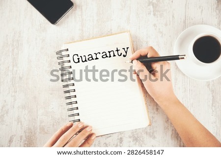 Concept of guaranty write on sticky notes 