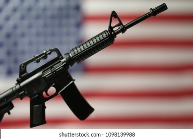 Concept For Gun Control Or Gun Rights - Second Amendment - AR15 Assault Style Rifle And American Flag