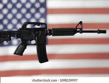 Concept For Gun Control Or Gun Rights - Second Amendment - AR15 Assault Style Rifle And American Flag