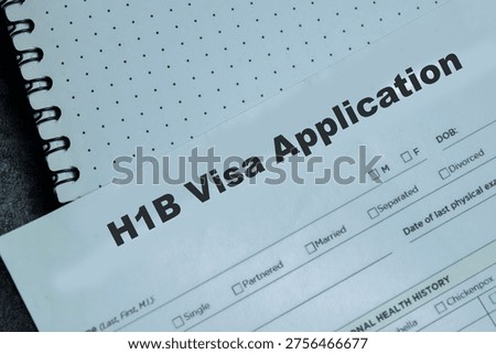Concept of H1B Visa Application write on clipboard isolated on Wooden Table.