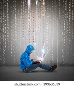 Concept of hackering with a boy with laptop and binary code