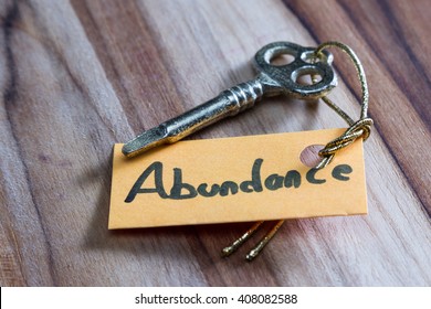 concept for a happy abundant life using an old decorative key and a hand written tag attached by a golden cord - Shutterstock ID 408082588