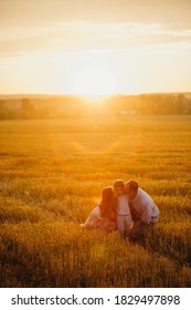 The Concept Of A Happy Family. Son With Mom And Daddy. Happy Family In The Field Evening Light Of A Sun. Mother, Father And Baby Son Happy Walk At Sunset, Parents Hold The Baby. 