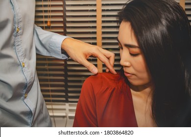 Concept Harassment Of Women In The Office : Unwanted Man's Hand Negative Behavior, Abuse Of Liberty, Fingers Touching Beautiful Woman's Shoulder While Working In Office Room 