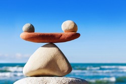 Concept Of Harmony And Balance. Balance Stones Against The Sea. Rock Zen In The Form Of Scales