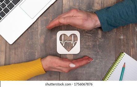 Concept of health insurance with hands in a protective gesture
