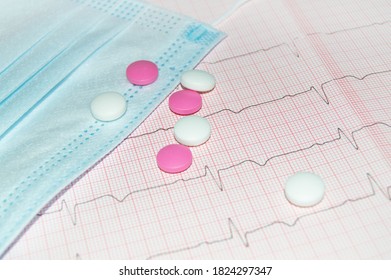 Concept Of A Healthy Heart With A Cardiogram, Mask And Pills, Top View, Cardiac Care. Concept Of Cardiology, Medicine And Insurance.