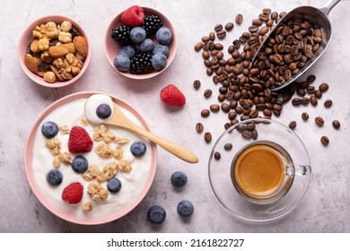 Concept Of Healthy Nutrition. Food For Breakfast, Top View, A Bowl With Low-fat Yogurt, Crunchy Oatmeal, Dried Fruit, Fresh Fruit And Espresso.