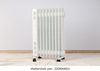 Concept of heating season, modern electric heater in room
