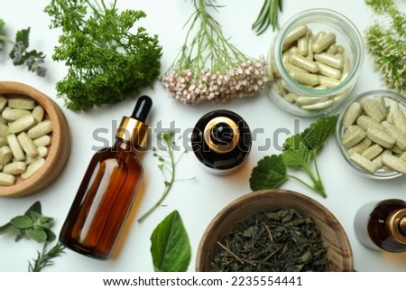 Concept of herbal medicine pills on white background, top view