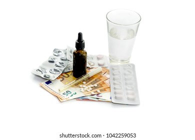 The Concept Of The High Cost Of Medicine And Large Spending On Medicaments. Pills, Glassful With Water, Mixture, Thermometer And Euros On A White Background Close-up