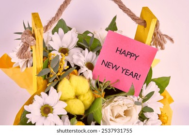 The concept of holidays. The conceptual congratulatory text, phrase, expression HAPPY NEW YEAR is written a red card in a bouquet of flowers. - Powered by Shutterstock